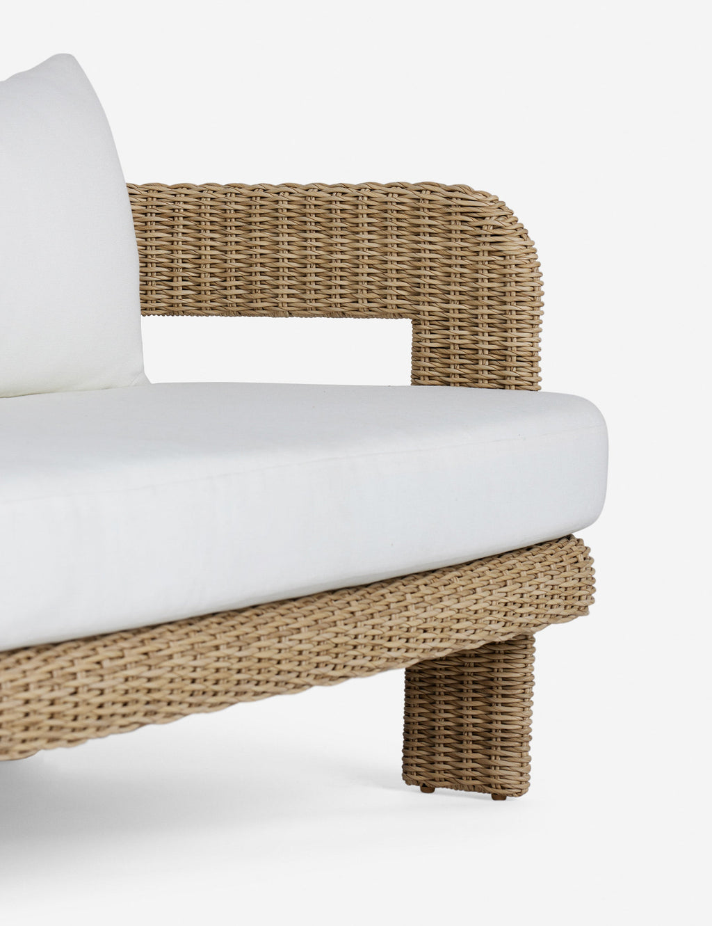 #color::natural | Arm of the Hadler modern sculptural open frame wicker outdoor sofa.