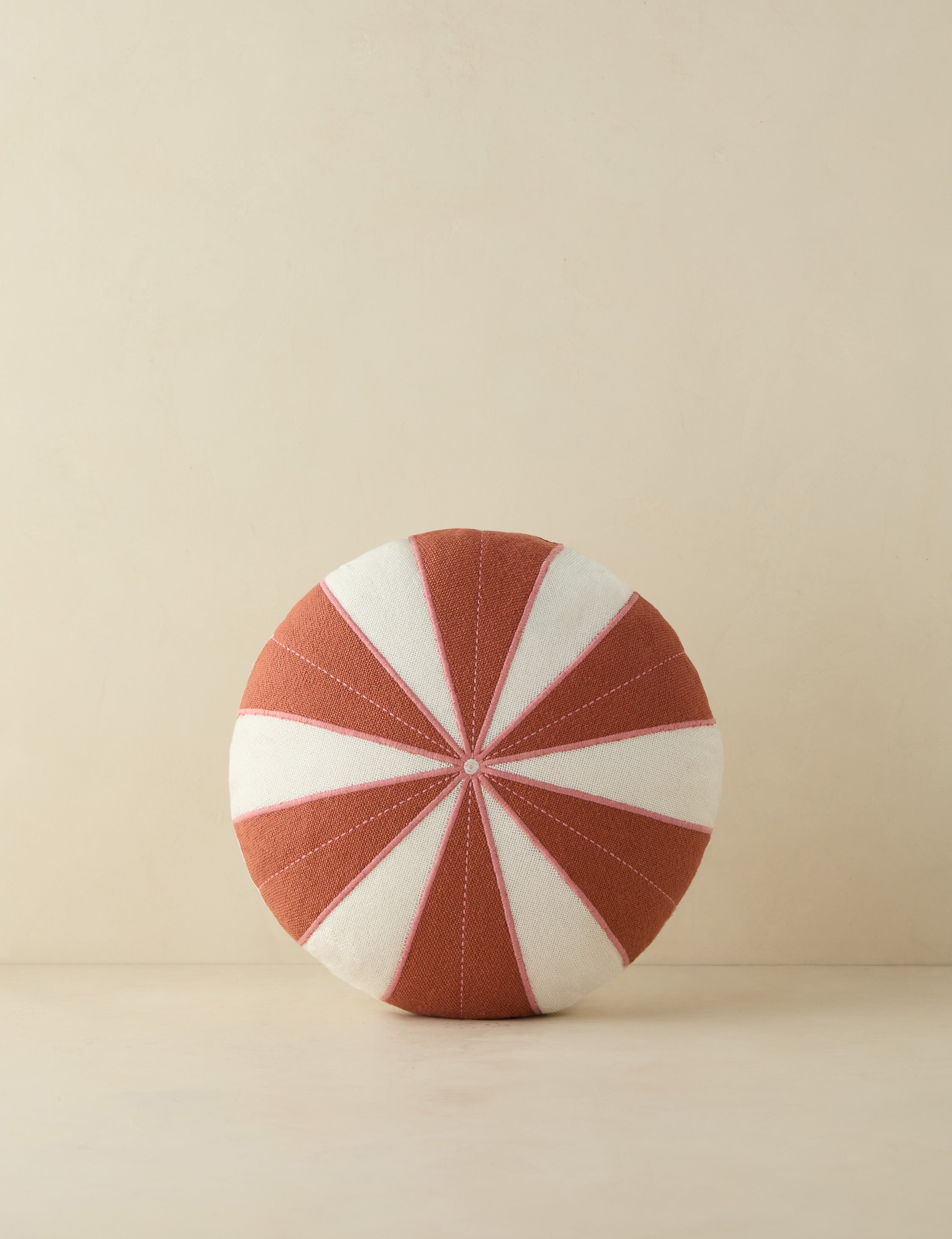 #color::rust | Wrenley high-contrast design disc outdoor pillow